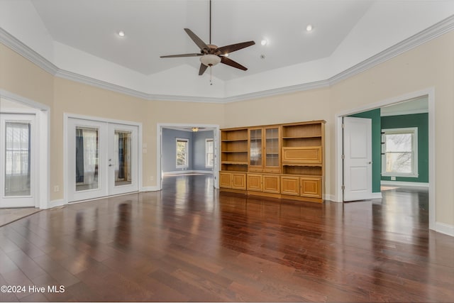 unfurnished living room with vaulted ceiling, ceiling fan, dark wood-type flooring, and crown molding