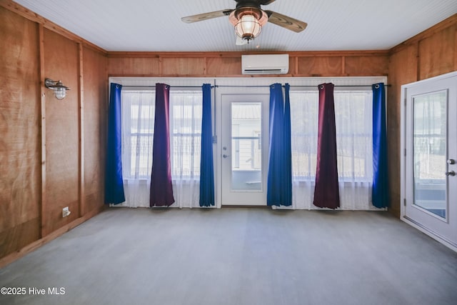 spare room featuring french doors, ceiling fan, crown molding, and wood walls