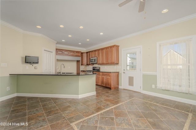 kitchen featuring dishwasher, ceiling fan, crown molding, and sink