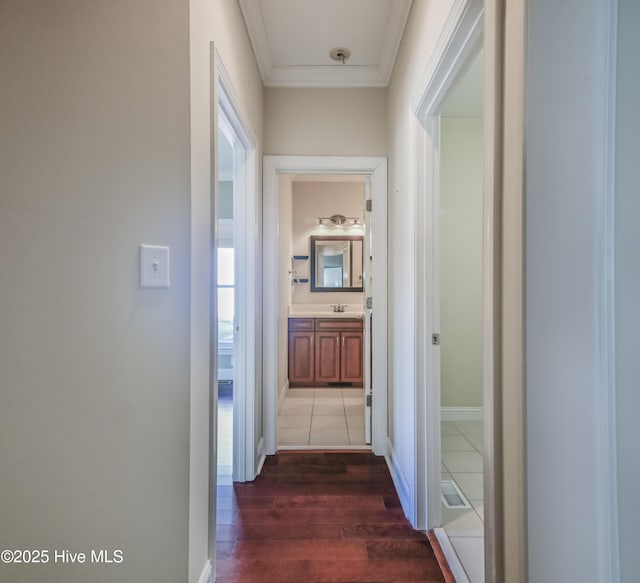 laundry area with sink, cabinets, separate washer and dryer, electric panel, and light tile patterned floors