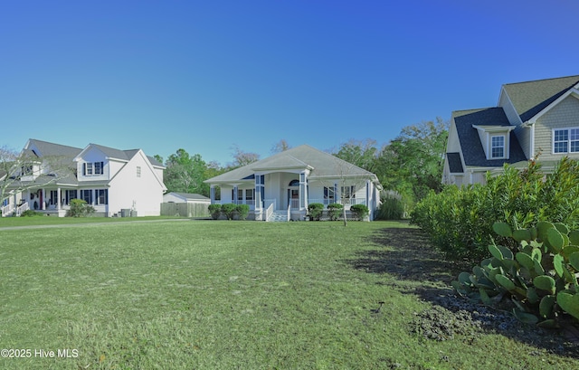 view of front facade with a front lawn and a porch