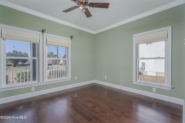 empty room featuring dark hardwood / wood-style flooring, ceiling fan, and ornamental molding