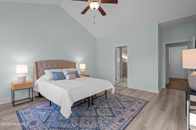 bedroom featuring ensuite bathroom, ceiling fan, high vaulted ceiling, and light hardwood / wood-style flooring