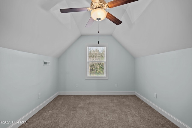 additional living space with lofted ceiling, carpet floors, and ceiling fan