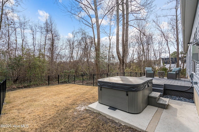 view of yard with a hot tub and a deck