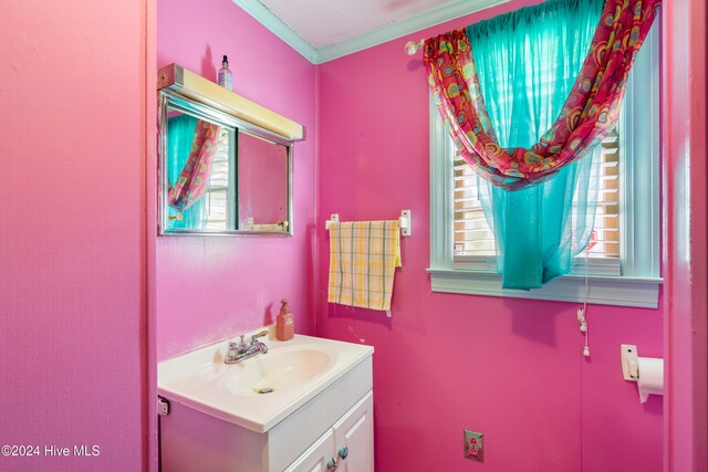 bathroom featuring vanity and ornamental molding