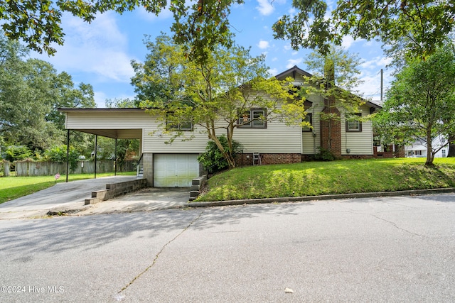 view of front facade with a front lawn and a carport