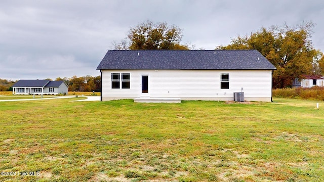 back of house with a yard