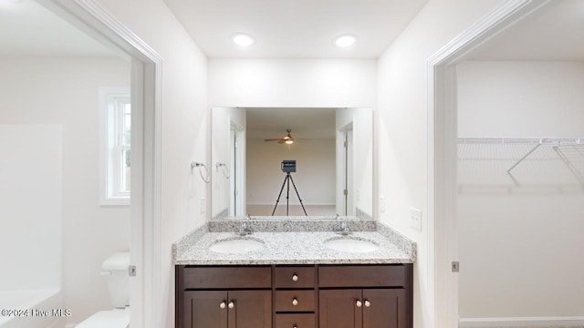 bathroom with vanity and ceiling fan