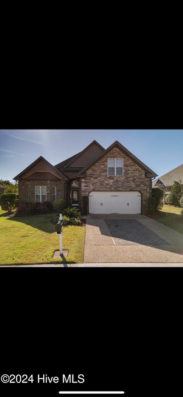 view of front of property with a front lawn