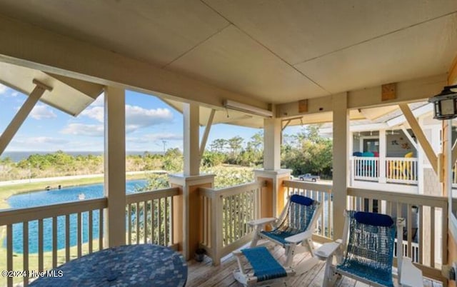 deck featuring a water view