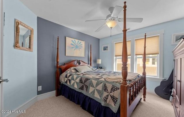 bedroom with light colored carpet and ceiling fan