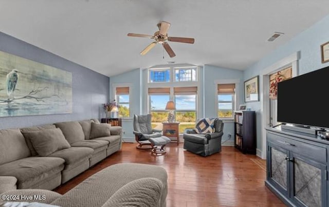 living room with ceiling fan, dark hardwood / wood-style flooring, and lofted ceiling