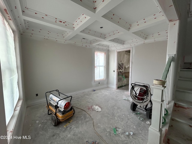 unfurnished bedroom featuring beamed ceiling and coffered ceiling