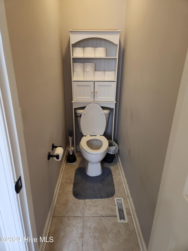 bathroom featuring tile patterned floors and toilet