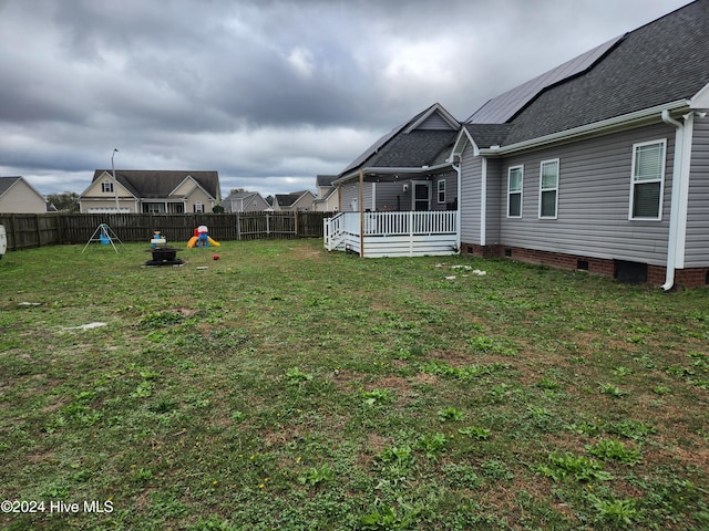 view of yard with a wooden deck