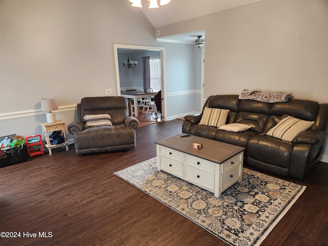 living room with vaulted ceiling, dark hardwood / wood-style floors, and a notable chandelier