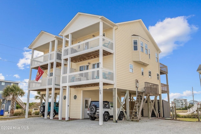 exterior space featuring a balcony and a carport