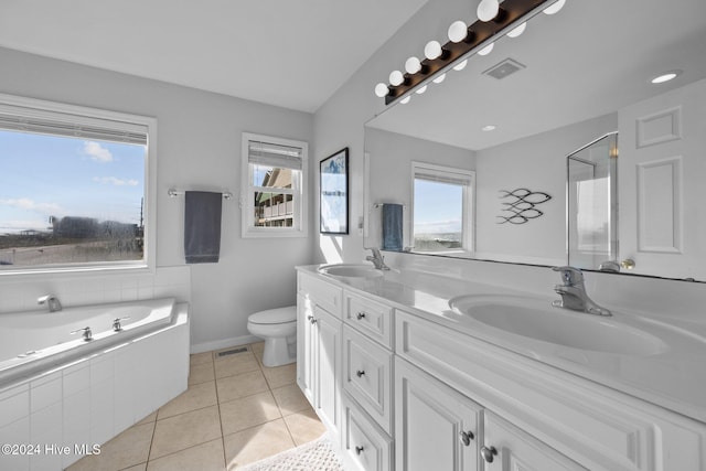 full bathroom with tile patterned floors, vanity, independent shower and bath, and toilet