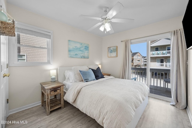 bedroom featuring ceiling fan, access to outside, and light hardwood / wood-style flooring