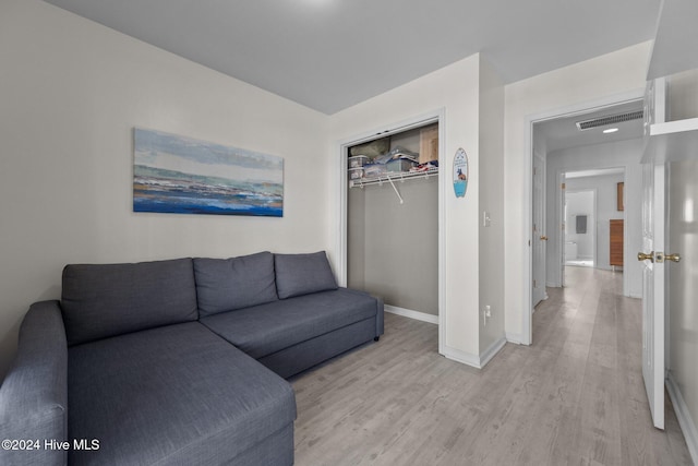 living room with light hardwood / wood-style floors