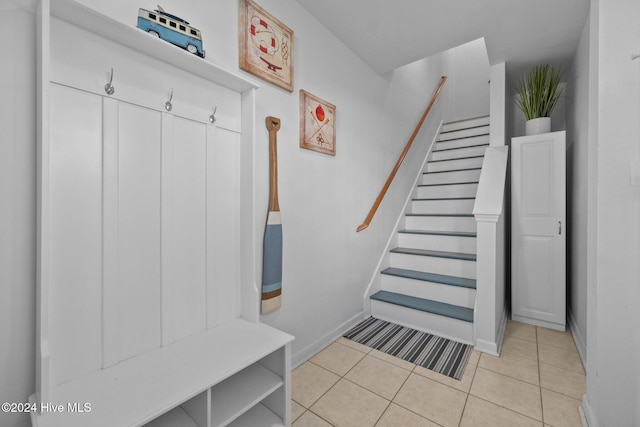 mudroom with light tile patterned flooring