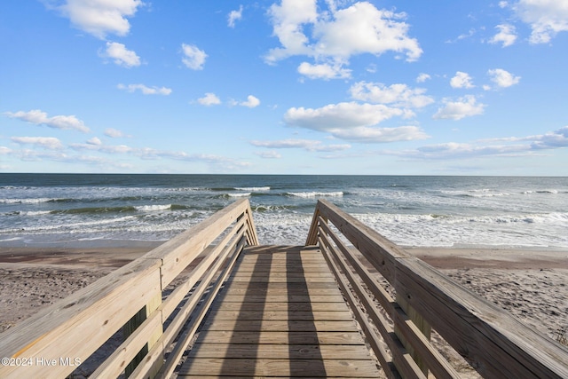 view of home's community featuring a view of the beach and a water view