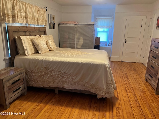 bedroom featuring light wood-type flooring