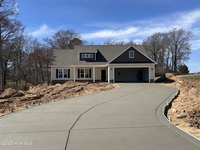 view of front of property with a garage and covered porch