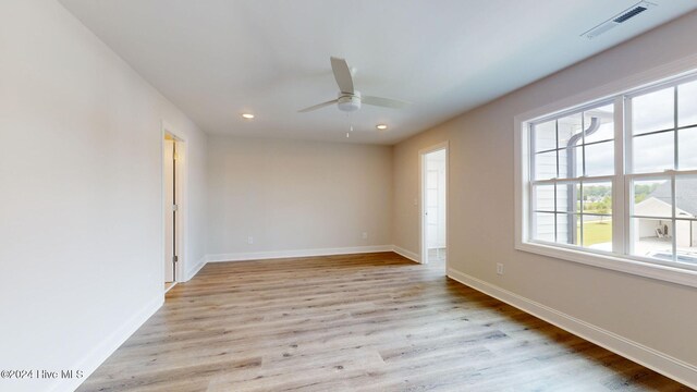 spare room with baseboards, visible vents, a ceiling fan, light wood-style floors, and recessed lighting