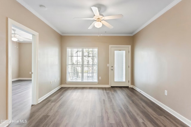 empty room featuring hardwood / wood-style floors, ceiling fan, and crown molding