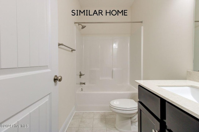 full bathroom featuring toilet, vanity, tile patterned floors, and  shower combination