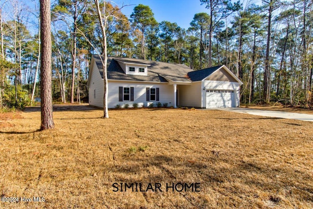 view of front of house featuring a front yard and a garage