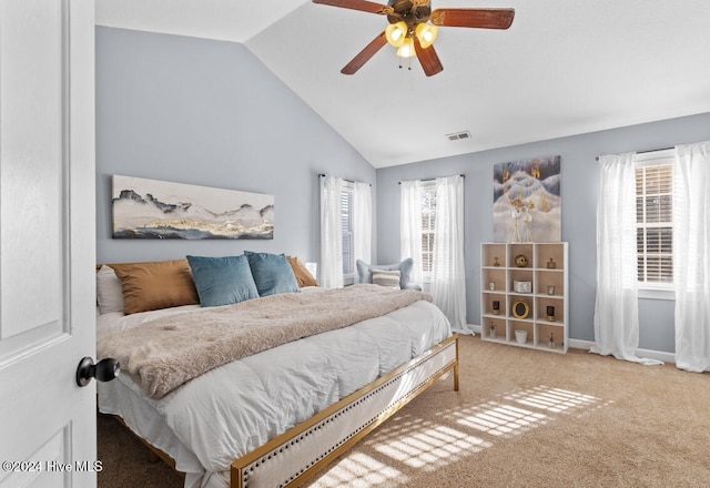 bedroom featuring ceiling fan, carpet floors, and vaulted ceiling