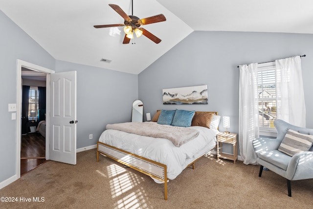 carpeted bedroom featuring ceiling fan and lofted ceiling