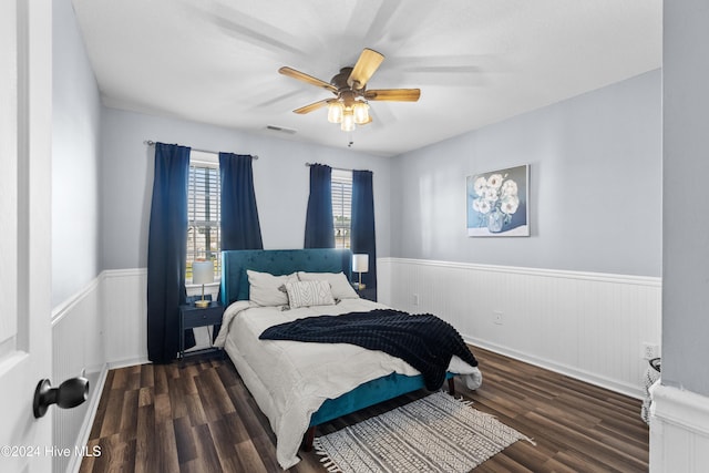 bedroom featuring ceiling fan and dark wood-type flooring