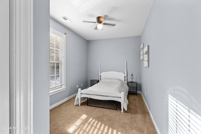 carpeted bedroom featuring ceiling fan