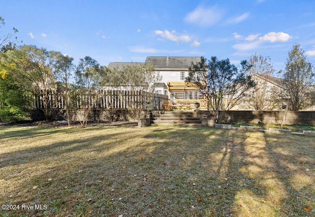 rear view of house with a lawn