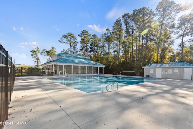 view of swimming pool featuring a patio area