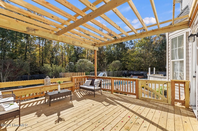 wooden deck featuring a pergola