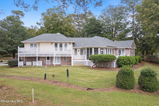 back of house with a yard