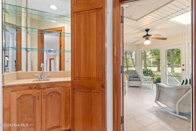 bathroom with ceiling fan, vanity, and wood ceiling