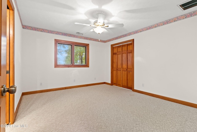 unfurnished bedroom with carpet and ceiling fan