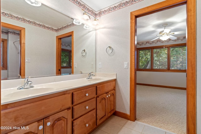 bathroom featuring tile patterned flooring, ceiling fan, and vanity