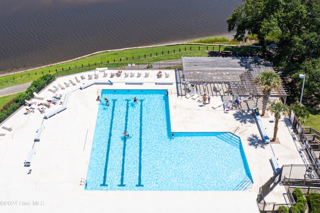 view of pool featuring a water view