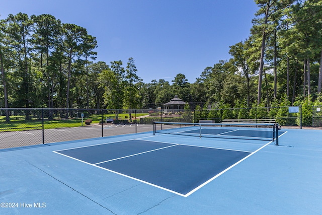 view of tennis court featuring basketball court