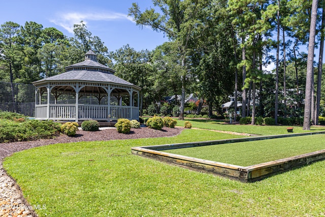 surrounding community featuring a gazebo and a yard