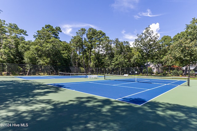 view of sport court featuring basketball hoop