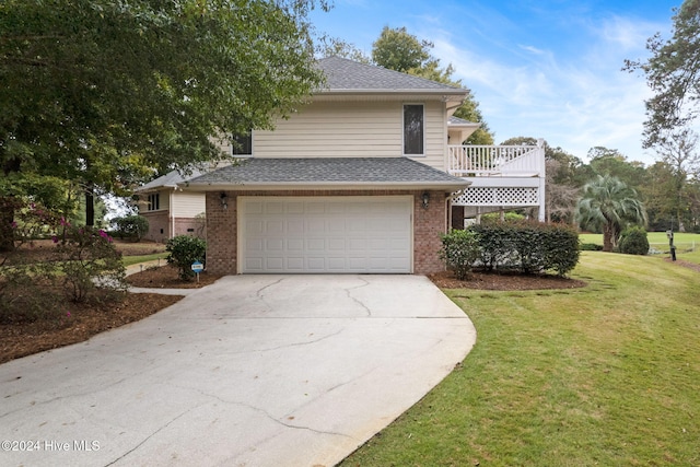 view of front property with a garage and a front yard