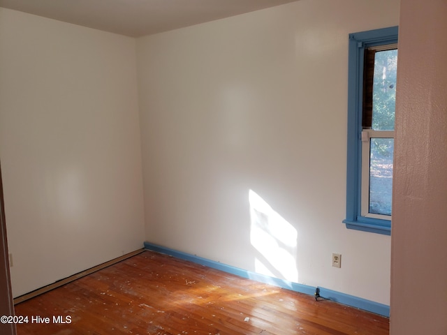 empty room featuring hardwood / wood-style flooring